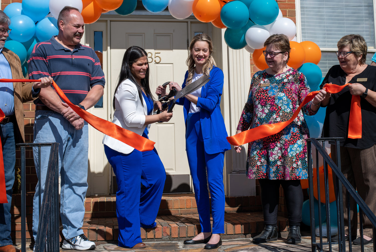 Viva Hydration's grand opening. Owners Lucy Nunnery and Juliana Baca Roman cut the ribbon at the grand opening event for Viva Hydration Saturday in downtown Siler City. Shown, from left, are Siler City Mayor Chip Price, Jay Underwood, Nunnery, Roman, and the Chatham Chamber of Commerce's Cindy Pointdexter and Cherry Littleton.
